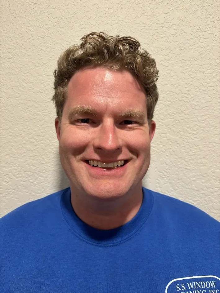 Parker of S.S. Window Cleaning, wearing a company shirt
